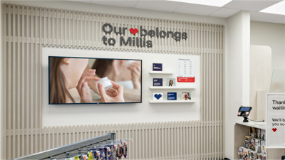 A CVS store featuring a waiting area screen