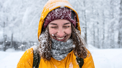 Woman smiling outside in the snow