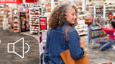 Woman shopping in store. Audio icon.