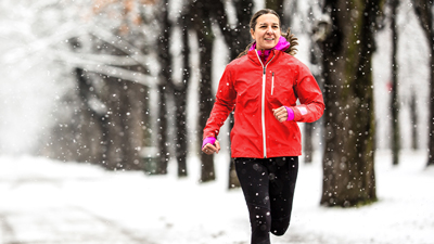 Woman jogging in snow